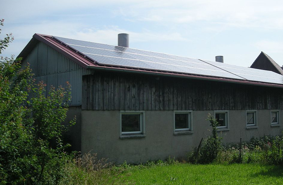 1200px-Gaugshausen_Jul_2012_7_(solar_powered_building).jpg